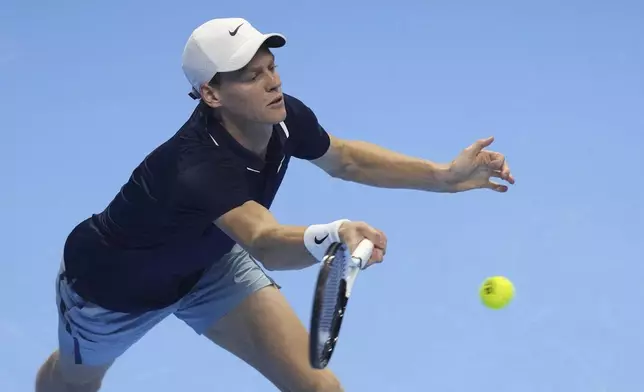 Italy's Jannik Sinner returns the ball to United States' Taylor Fritz during their singles tennis match of the ATP World Tour Finals at the Inalpi Arena, in Turin, Italy, Tuesday, Nov. 12, 2024. (AP Photo/Antonio Calanni)