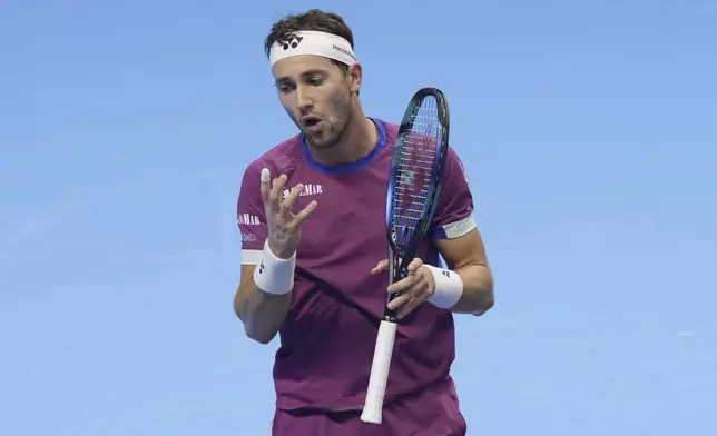 Norway's Casper Ruud reacts during a semifinal tennis match of the ATP World Tour Finals against Italy's Jannik Sinner at the Inalpi Arena in Turin, Italy, Saturday, Nov. 16, 2024. (AP Photo/Antonio Calanni)