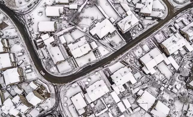 An aerial view of the snow in Holmfirth, west Yorkshire, Tuesday Nov. 19, 2024. (Danny Lawson/PA via AP)