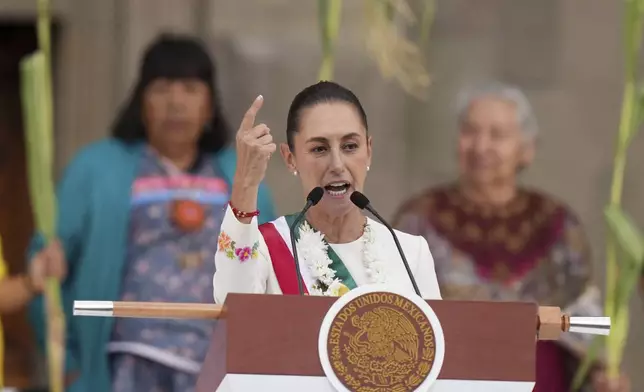 FILE - Newly-sworn in President Claudia Sheinbaum addresses supporters in the Zócalo, Mexico City's main square, on Oct. 1, 2024. (AP Photo/Fernando Llano, File)