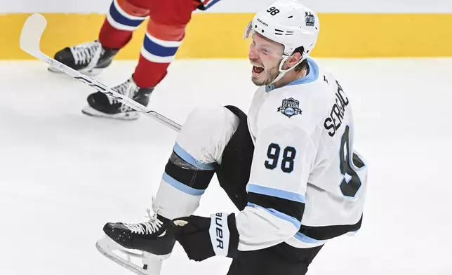 Utah Hockey Club's Mikhail Sergachev (98) reacts after scoring against the Montreal Canadiens during overtime in an NHL hockey game in Montreal, Tuesday, Nov. 26, 2024. (Graham Hughes/The Canadian Press via AP)