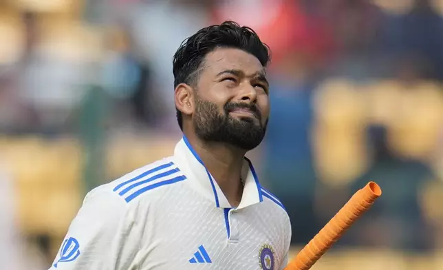 FILE - India's Rishabh Pant reacts as he walks off the field after losing his wicket during the day four of the first cricket test match between India and New Zealand at the M.Chinnaswamy Stadium, in Bengaluru, India, on Oct. 19, 2024. (AP Photo/Aijaz Rahi, File)