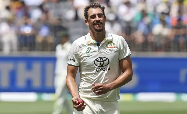 FILE - Australia's Mitchell Starc prepares to bowl during play in the first cricket test between India and Australia in Perth, Australia, on Nov. 22, 2024. (AP Photo/Trevor Collens, File)