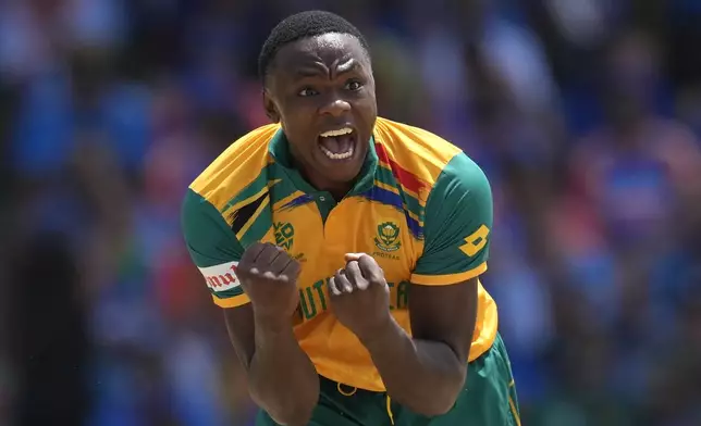 FILE - South Africa's Kagiso Rabada celebrates the dismissal of India's Suryakumar Yadav during the ICC Men's T20 World Cup final cricket match between India and South Africa at Kensington Oval in Bridgetown, Barbados, on June 29, 2024. (AP Photo/Ricardo Mazalan, File)