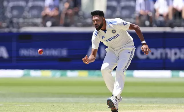 FILE - India's Mohammed Siraj fields the ball on the fourth day of the first cricket test between Australia and India in Perth, Australia, on Nov. 25, 2024. (AP Photo/Trevor Collens, File)