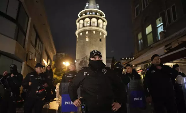 Turkish police stand guard during a protest marking the International Day for the Elimination of Violence Against Women, in Istanbul, Turkey, Monday, Nov. 25, 2024. (AP Photo/Emrah Gurel)