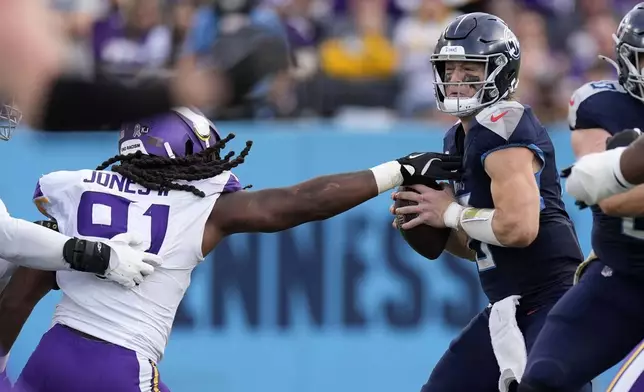 Tennessee Titans quarterback Will Levis is sacked by Minnesota Vikings linebacker Pat Jones II (91) during the second half of an NFL football game, Sunday, Nov. 17, 2024, in Nashville, Tenn. (AP Photo/George Walker IV)