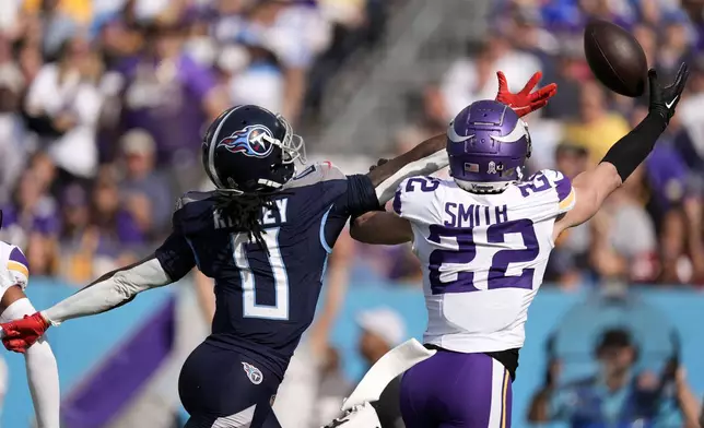 Minnesota Vikings safety Harrison Smith (22) breaks up a pass intended for Tennessee Titans wide receiver Calvin Ridley (0) during the first half of an NFL football game, Sunday, Nov. 17, 2024, in Nashville, Tenn. (AP Photo/George Walker IV)