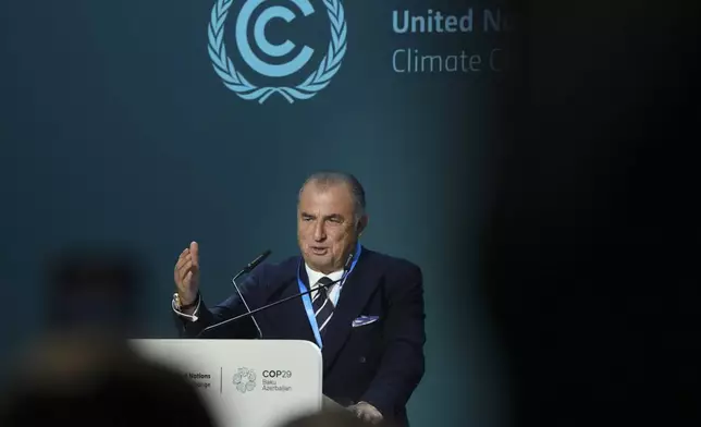 Fatih Terim, football manager and former player, speaks during an event on the Football Clubs Alliance for Climate at the COP29 U.N. Climate Summit, Saturday, Nov. 16, 2024, in Baku, Azerbaijan. (AP Photo/Sergei Grits)