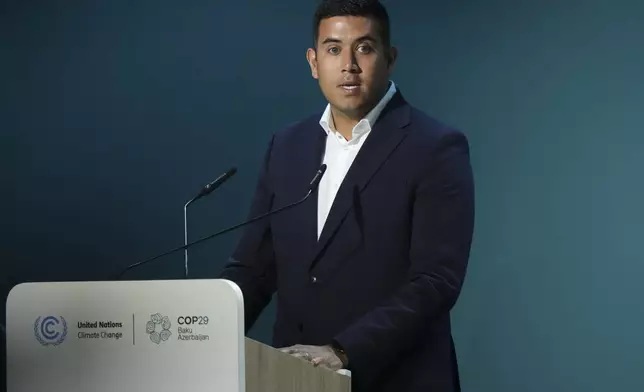 Rishi Jain, director of impact for FC Liverpool, speaks during an event on the Football Clubs Alliance for Climate at the COP29 U.N. Climate Summit, Saturday, Nov. 16, 2024, in Baku, Azerbaijan. (AP Photo/Sergei Grits)