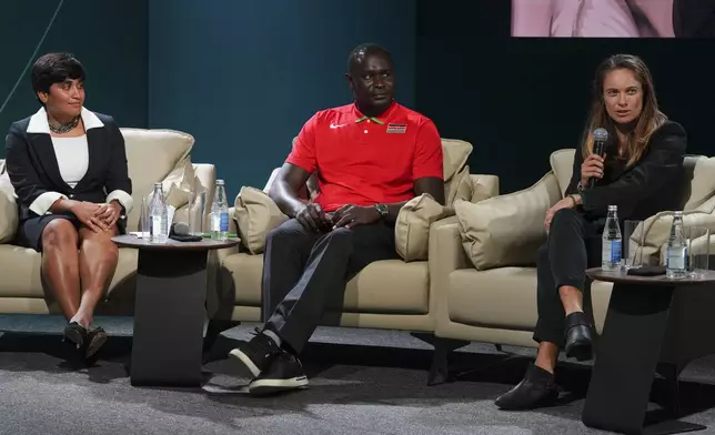 Indian triathlete Pragnya Mohan, from left, David Rudisha, former Kenyan runner, and Katie Rood, New Zealand soccer player, attend a session on sports for climate action during the COP29 U.N. Climate Summit, Monday, Nov. 18, 2024, in Baku, Azerbaijan. (AP Photo/Peter Dejong)