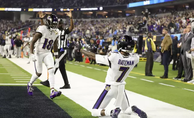 Baltimore Ravens wide receiver Rashod Bateman (7) celebrates his touchdown catch with wide receiver Diontae Johnson (18) during the first half of an NFL football game against the Los Angeles Chargers, Monday, Nov. 25, 2024, in Inglewood, Calif. (AP Photo/Ryan Sun)