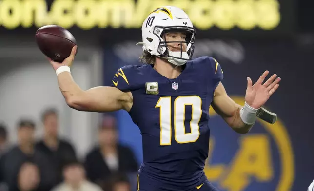 Los Angeles Chargers quarterback Justin Herbert (10) throws a pass during the first half of an NFL football game against the Baltimore Ravens, Monday, Nov. 25, 2024, in Inglewood, Calif. (AP Photo/Eric Thayer)