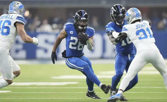 Indianapolis Colts running back Jonathan Taylor rushes during the first half of an NFL football game against the Detroit Lions, Sunday, Nov. 24, 2024, in Indianapolis. (AP Photo/AJ Mast)