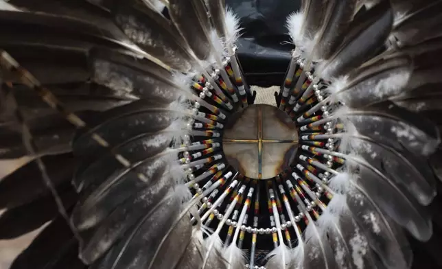 Feathers are displayed on regalia during a powwow at Chinook Winds Casino Resort, Saturday, Nov. 16, 2024, in Lincoln City, Ore. (AP Photo/Jenny Kane)