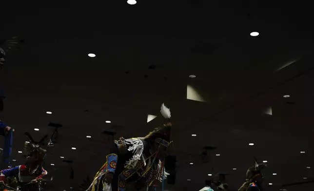 People dance during a powwow at Chinook Winds Casino Resort, Saturday, Nov. 16, 2024, in Lincoln City, Ore. (AP Photo/Jenny Kane)