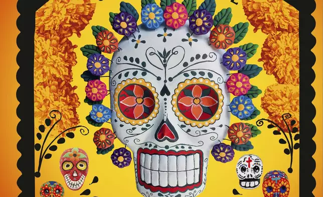 This photo shows the cover of “The Day of the Dead: A Celebration of Death and Life” by Déborah Holtz and Juan Carlos Mena. Coffee table books are good options for holiday gifts. (Rizzoli via AP)