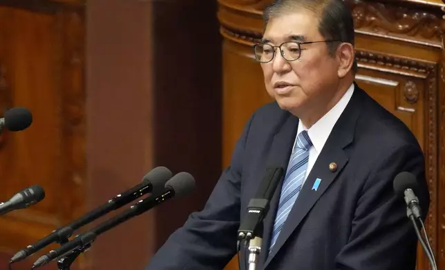 Japanese Prime Minister Shigeru Ishiba delivers his policy speech at the extraordinary session of parliament's lower house Friday, Nov. 29, 2024, in Tokyo. (AP Photo/Eugene Hoshiko)