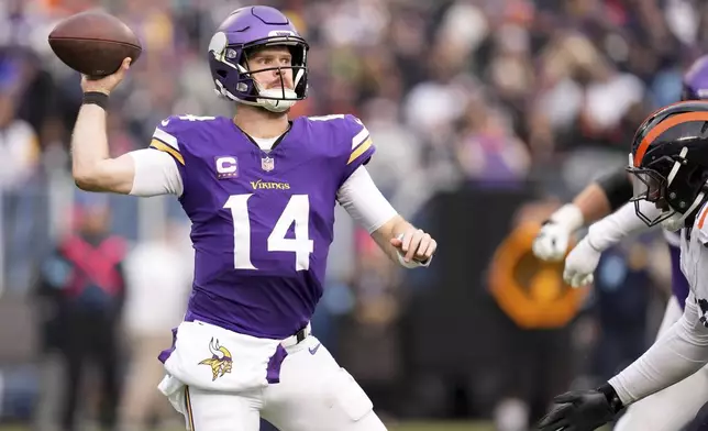 Minnesota Vikings quarterback Sam Darnold (14) throws a pass during the second half of an NFL football game against the Chicago Bears, Sunday, Nov. 24, 2024, in Chicago. (AP Photo/Erin Hooley)