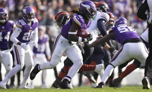 Minnesota Vikings linebacker Brian Asamoah II (6) runs back after recovering the ball on a blocked punt during the first half of an NFL football game against the Minnesota Vikings, Sunday, Nov. 24, 2024, in Chicago. (AP Photo/Erin Hooley)