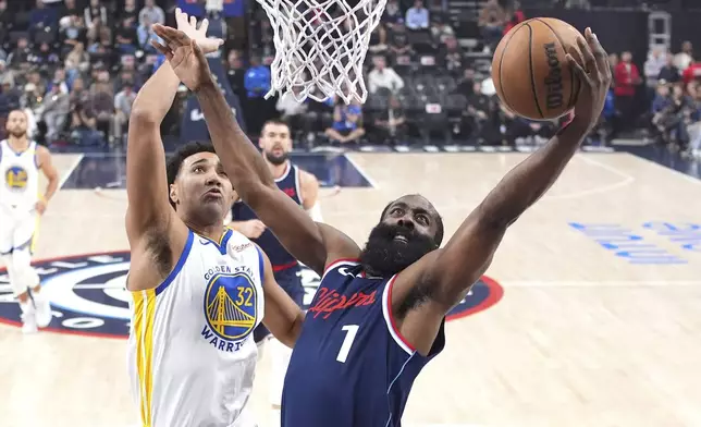 Los Angeles Clippers guard James Harden, right, shoots as Golden State Warriors forward Trayce Jackson-Davis defends during the second half of an NBA basketball game, Monday, Nov. 18, 2024, in Inglewood, Calif. (AP Photo/Mark J. Terrill)