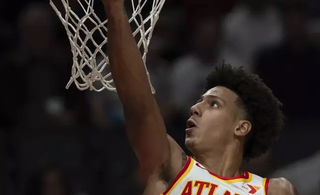 Atlanta Hawks forward Jalen Johnson drives to the basket during the first half of an NBA basketball game against the Portland Trail Blazers, Sunday, Nov. 17, 2024, in Portland, Ore. (AP Photo/Jenny Kane)