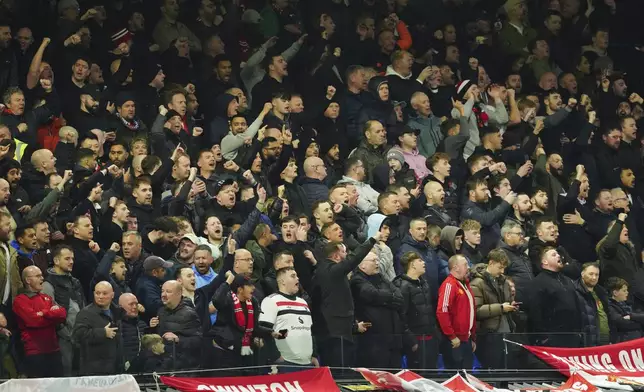 Manchester United's fans cheer for their team prior to the English Premier League soccer match between Ipswich Town and Manchester United at Portman Road stadium in Ipswich, England, Sunday, Nov. 24, 2024. (AP Photo/Dave Shopland)