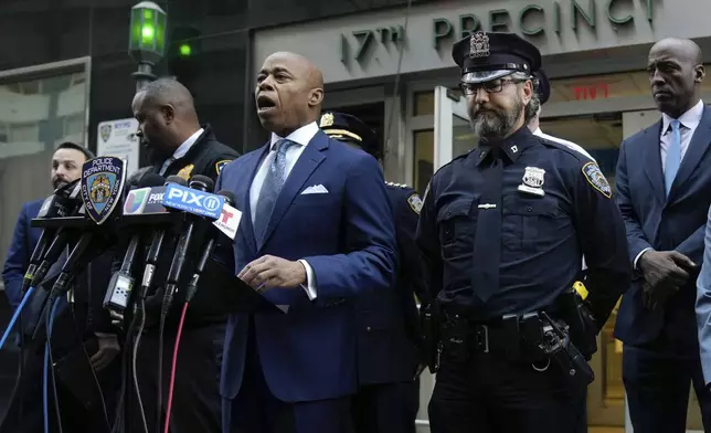 This image provided by Office of the New York Mayor shows New York Mayor Eric Adams, left center, as he briefs the media on a series of incidents that took place within the confines of the 10th and 17th Police Precincts, Monday, Nov. 18, 2024. (Mayoral Photography Office/Michael Appleton via AP)