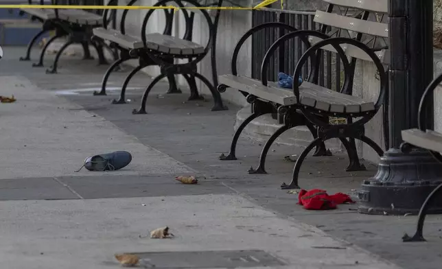 A shoe is left at the site of a stabbing spree near the United Nations Headquarters in New York, Monday, Nov. 18, 2024. (AP Photo/Yuki Iwamura)