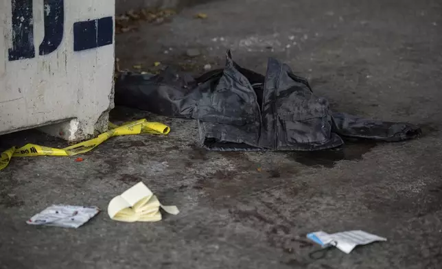 A jacket covered in blood lays on the ground at the site of a stabbing spree near the United Nations Headquarters in New York, Monday, Nov. 18, 2024. (AP Photo/Yuki Iwamura)