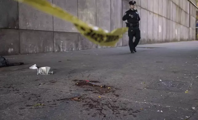 Blood stains is the ground at the site of stabbing spree near the United Nations Headquarters in New York, Monday, Nov. 18, 2024. (AP Photo/Yuki Iwamura)