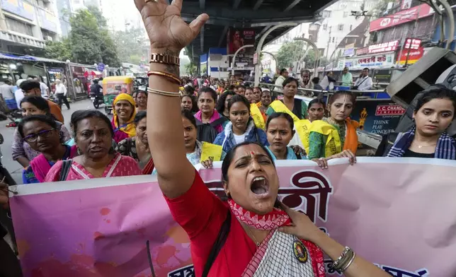 An activist shouts slogan as she leads a rally to mark the International Day for the Elimination of Violence against Women, in Kolkata, India, Monday, Nov. 25, 2024. (AP Photo/Bikas Das)