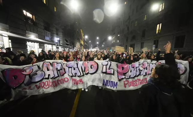 Women attend a rally to mark the International Day for the Elimination of Violence against women, in Milan, Italy, Monday, Nov. 25, 2024. (AP Photo/Luca Bruno)