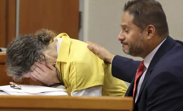 Defendant Susan Lorincz, left, who fatally shot a Black neighbor through her front door during an ongoing dispute, weeps during her sentencing hearing Monday, Nov. 25, 2024, in Ocala, Fla. (Bruce Ackerman/Ocala Gazette via AP, Pool)