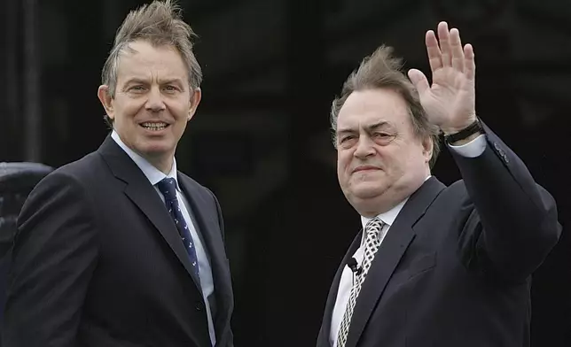 FILE -Britain's Prime Minister Tony Blair, left, turns towards the media with his Deputy John Prescott, on the pier at Gravesend in Kent, England during a visit to promote urban regeneration,March 31, 2005. (AP Photo/Alastair Grant, Pool, File)