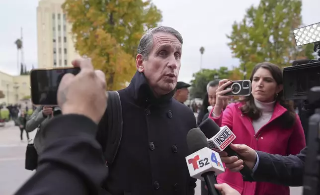 Bryan Freedman, an attorney representing family members of Erik and Lyle Menendez, talks to reporters outside a courthouse in Los Angeles, Monday, Nov. 25, 2024. (AP Photo/Jae C. Hong)