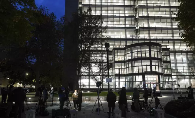 Media members gather outside the Van Nuys Courthouse West in Los Angeles, Monday, Nov. 25, 2024, where a hearing is scheduled in the case of Lyle and Erik Menendez, who are serving life sentences without the possibility of parole for the shotgun murders of their parents in their Beverly Hills home more than 30 years ago. (AP Photo/Jae C. Hong)
