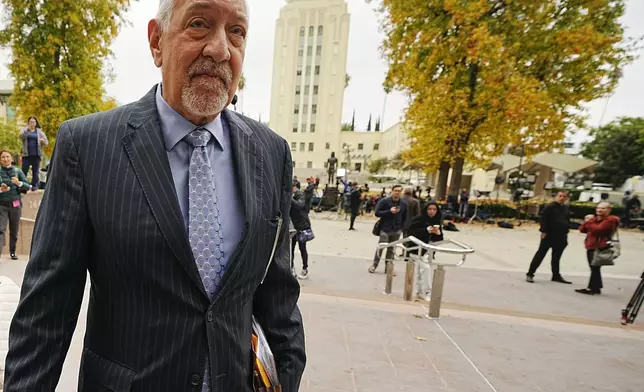 Defense Attorney Mark Geragos, arrives at the Van Nuys courthouse in Los Angeles, for a hearing for Erik and Lyle Menendez, on Monday, Nov. 25, 2024. (AP Photo/Damian Dovarganes)