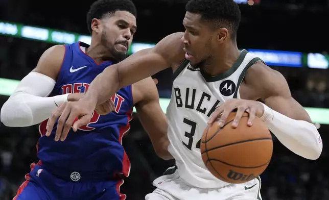 Milwaukee Bucks' Giannis Antetokounmpo tries to get past Detroit Pistons' Tobias Harris during the second half of an NBA basketball game Wednesday, Nov. 13, 2024, in Milwaukee. (AP Photo/Morry Gash)