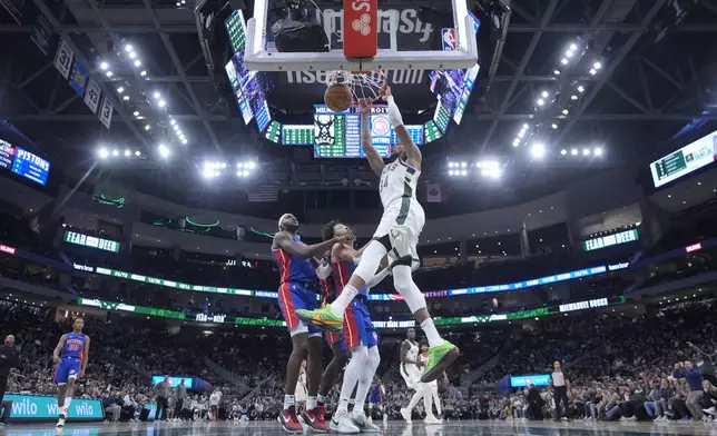 Milwaukee Bucks' Giannis Antetokounmpo dunks during the second half of an NBA basketball game against the Detroit Pistons Wednesday, Nov. 13, 2024, in Milwaukee. (AP Photo/Morry Gash)