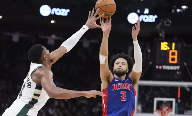 Detroit Pistons' Cade Cunningham shoots past Milwaukee Bucks' Giannis Antetokounmpo during the first half of an NBA basketball game Wednesday, Nov. 13, 2024, in Milwaukee. (AP Photo/Morry Gash)