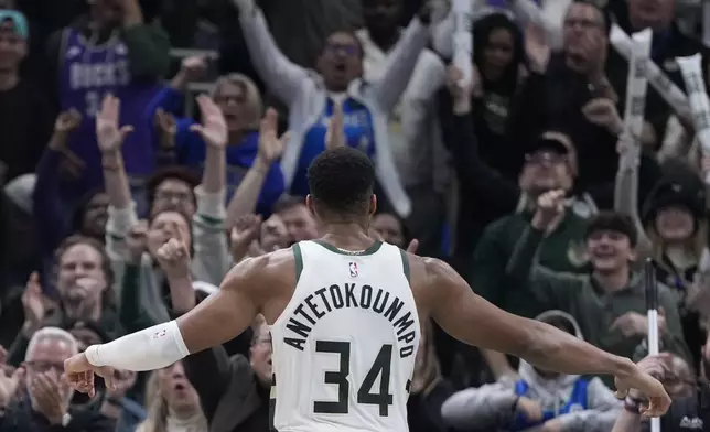 Milwaukee Bucks' Giannis Antetokounmpo celebrates after an overtime win against the Detroit Pistons after an NBA basketball game Wednesday, Nov. 13, 2024, in Milwaukee. (AP Photo/Morry Gash)