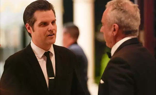 Matt Gaetz talks with Robert F. Kennedy Jr., before President-elect Donald Trump speaks during an America First Policy Institute gala at his Mar-a-Lago estate, Thursday, Nov. 14, 2024, in Palm Beach, Fla. (AP Photo/Alex Brandon)