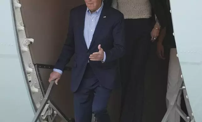 U.S. President Joe Biden deplanes in Lima, Peru, to attend the Asia-Pacific Economic Cooperation (APEC) summit, Thursday, Nov. 14, 2024. (AP Photo/Guadalupe Pardo)