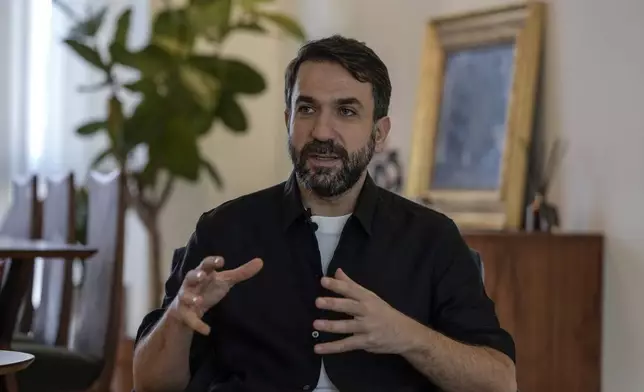 Lubnan Baalbaki speaks during an interview with The Associated Press at his house in Geitawi, Beirut, Lebanon, Thursday, Oct. 31, 2024. (AP Photo/Bilal Hussein)