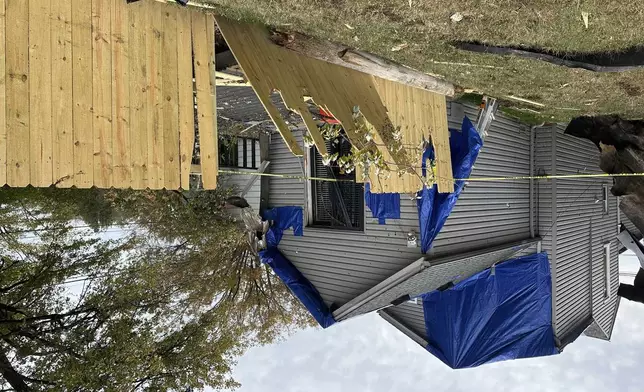 A residential fence near a Louisville, Kentucky, plant that exploded is pictured on Wednesday, Nov. 13, 2024. (AP Photo/Dylan Lovan)