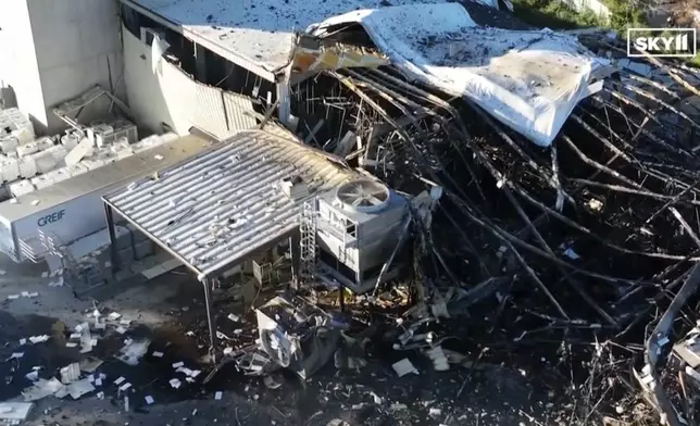 This image taken from video from WHAS 11 News shows damage after an explosion injured multiple employees at Givaudan Sense Color, Tuesday, Nov. 12, 2024, in Louisville, Ky. (WHAS 11 News via AP)