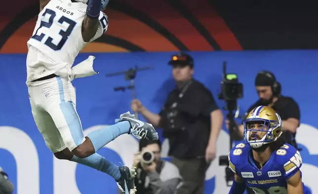 Toronto Argonauts' Benjie Franklin (23) can't make an interception on a pass intended for Winnipeg Blue Bombers' Kenny Lawler (89) during the second half of a CFL football game at the 111th Grey Cup in Vancouver, British Columbia, Sunday, Nov. 17, 2024. (Nathan Denette/The Canadian Press via AP)