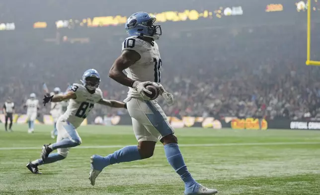 Toronto Argonauts' Kevin Mital (10) scores a touchdown against the Winnipeg Blue Bombers during the second half of a CFL football game at the 111th Grey Cup in Vancouver, British Columbia, Sunday, Nov. 17, 2024. (Darryl Dyck/The Canadian Press via AP)