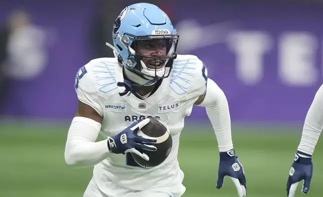 Toronto Argonauts' DaShaun Amos (8) runs back an interception against the Winnipeg Blue Bombers during the second half of a CFL football game at the 111th Grey Cup in Vancouver, British Columbia, Sunday, Nov. 17, 2024. (Frank Gunn/The Canadian Press via AP)